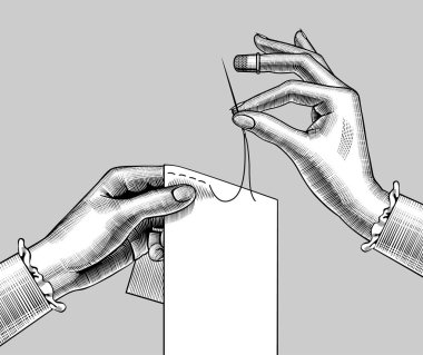 Female hands sewing with the needle a piece of cloth clipart