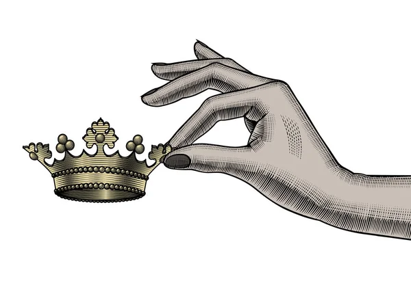 Θηλυκό χέρι κρατώντας στα δάχτυλα ένα χρυσό στέμμα — Διανυσματικό Αρχείο