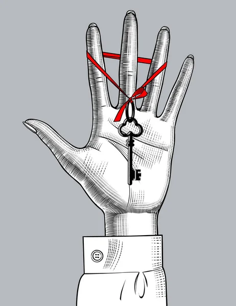 Mano de palma femenina con llave vieja con cinta roja — Vector de stock