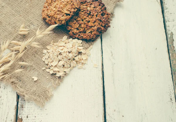 fresh oatmeal cookies and milk on background,close up