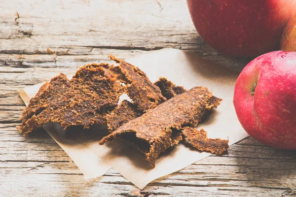 Natural apple dried chips on background,close up