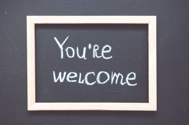 You're welcome handwritten on a chalkboard  clipart