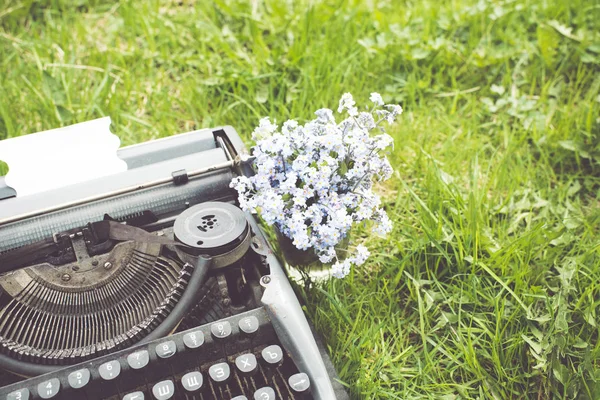 Old typewriter with blank paper