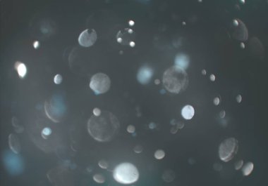 parlayan parlak bokeh toz