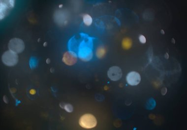 parlayan parlak bokeh toz parıltıları