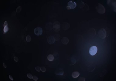 parlayan parlak bokeh toz parıltıları