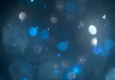 parlayan parlak bokeh toz parıltılar arka plan