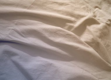 Buruşmuş parçalara sahip dokulu kumaş yüzey