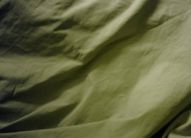 Buruşmuş parçalara sahip dokulu kumaş yüzey