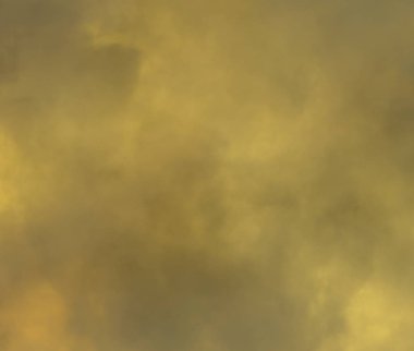 Siyah arka plan üzerinde sarı sis ve sis etkisi.