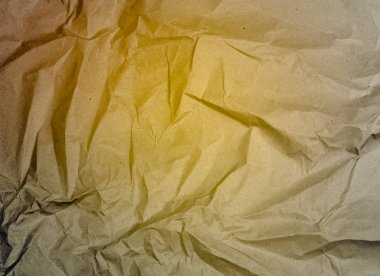 bir arka plan üzerinde sarı buruşturulmuş kağıt