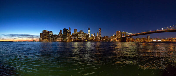 Panoramic view of New York City after sunset from Brooklyn