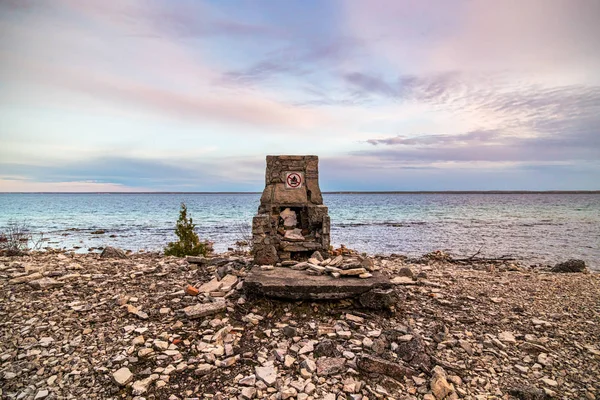 A man made structure beside the trail at sunset on Flowerpot Island in Ontario, Canada