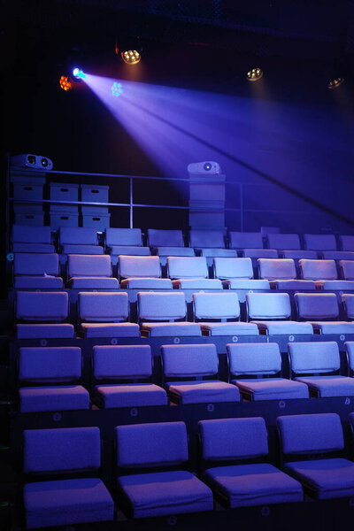 Close-up of the seats and spotlights in a theater screening room