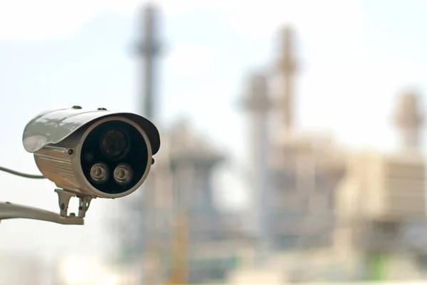 CCTV camera (closed circuit camera) surveillance Safety system with power plant on background