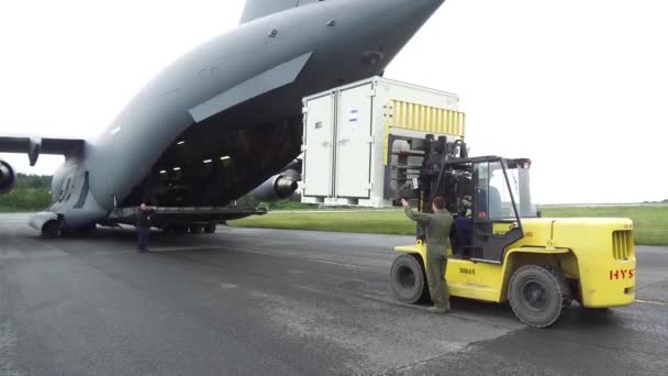 Man Giving Directions Boarding Ground Support Vehicle Cargo Plane — Stock Video