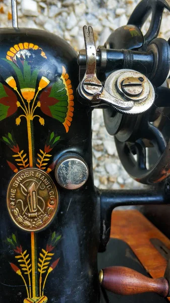 Old sewing machine vintage retro close up. Singer Factory Emblem