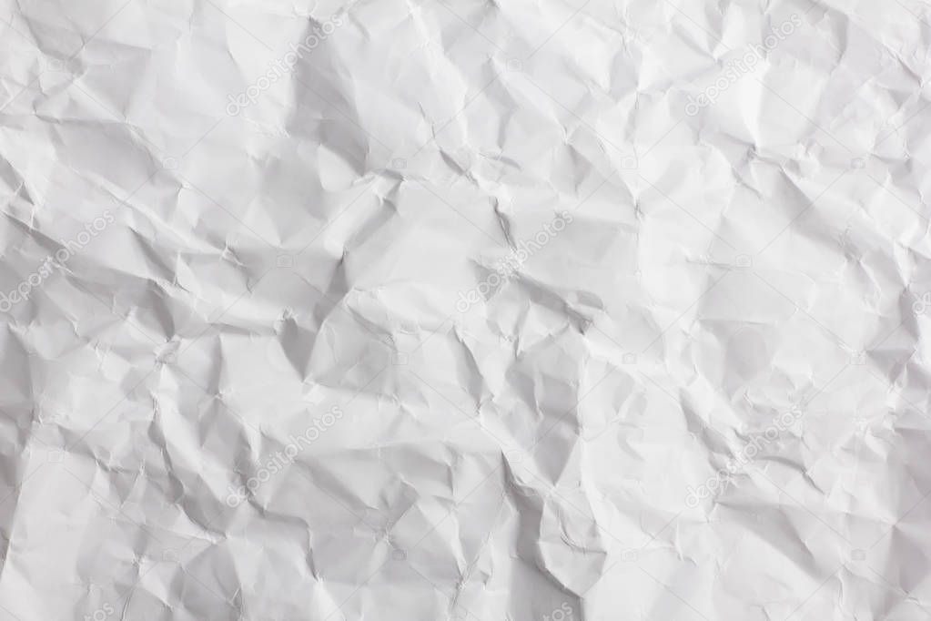 Crumpled paper sheet texture background.