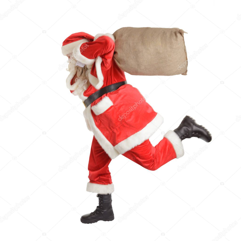 Hurried Santa Claus is running fast. Isolated on white background.