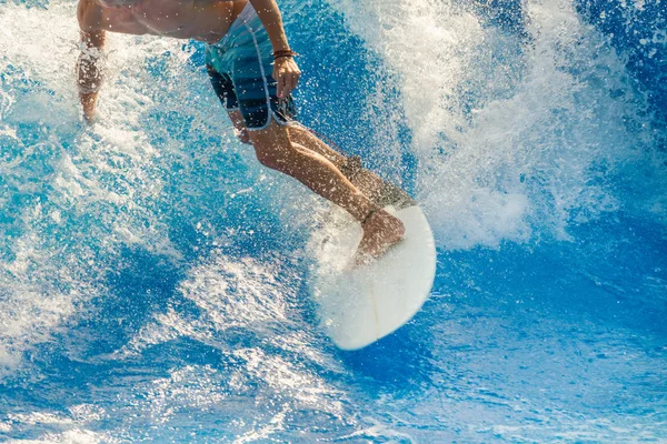 Surfer riding the waves.