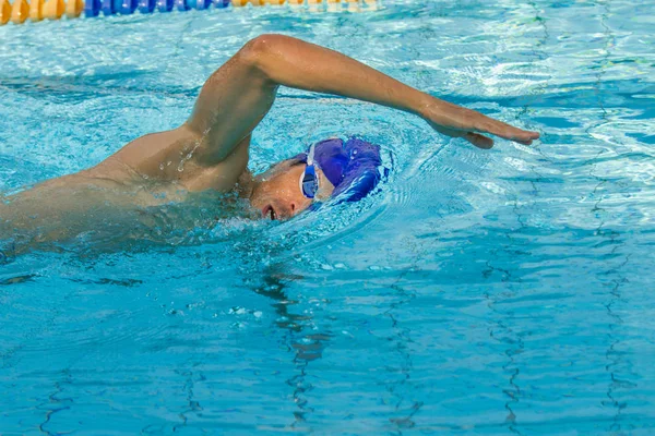 Man swimming in a swimming pool