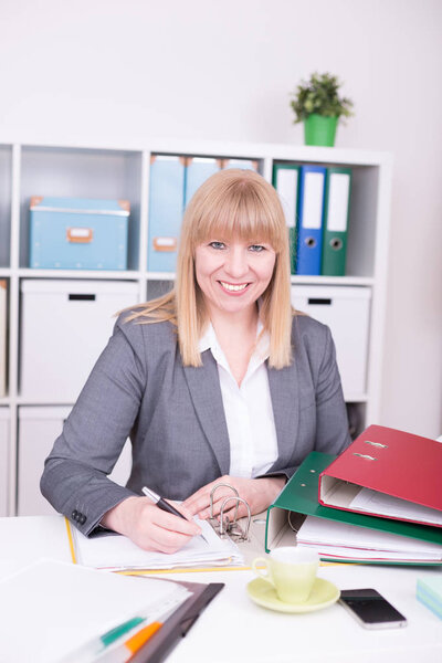 Businesswoman with happy emotions at work at the office.