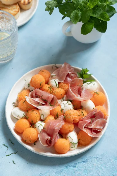 Cantaloupe melon salad with mozzarella and ham — Stock Photo, Image