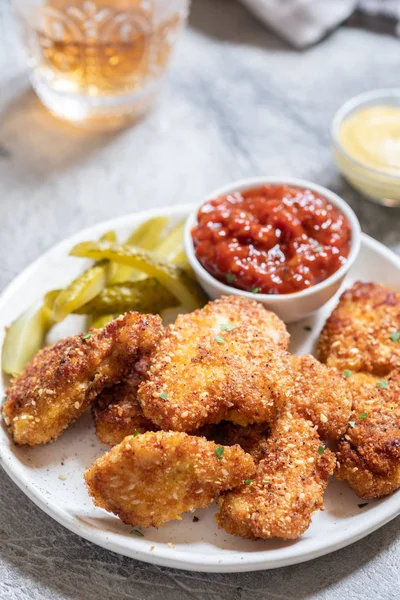 Fried crispy chicken nuggets with ketchup and pickles — Stock Photo, Image