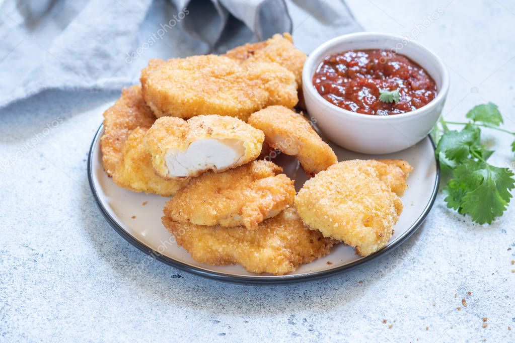 Fried crispy chicken nuggets with sauce