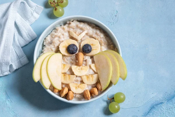 Kids breakfast porridge with fruits and nuts — Stock Photo, Image