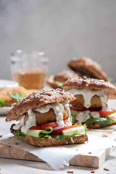 Fish seafood burger with mayo and fresh vegetables — Stock Photo, Image