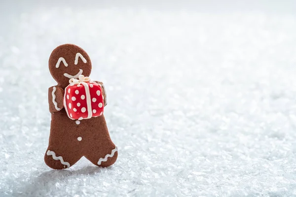 Gingerbread cookie men with tiny marzipan snowman — Stock Photo, Image
