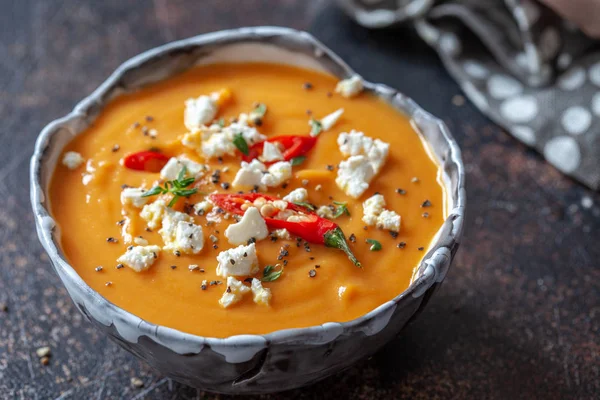 Roasted pumpkin soup with feta cheese and chili pepper — Stock Photo, Image