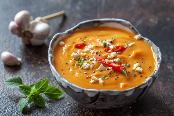 Roasted pumpkin soup with feta cheese and chili pepper — Stock Photo, Image
