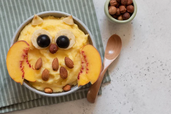 Kids breakfast polenta porridge with fruit — Stock Photo, Image