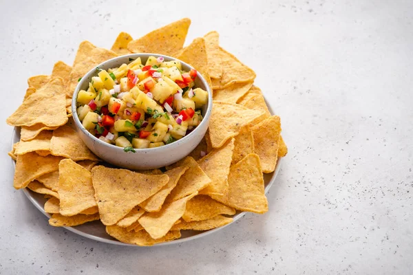 Pineapple salsa with nachos — Stock Photo, Image