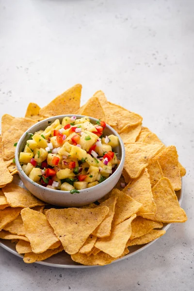 Pineapple salsa with nachos — Stock Photo, Image