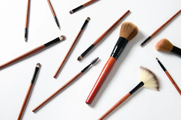 Professional makeup tools. Makeup brushes. magazines, social media. Top view. Flat lay.