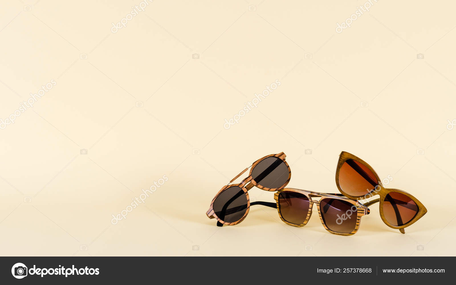 Wooden sunglasses of different design on yellow background. Copy space.  Sunglasses sale concept. For banner optic shop Stock Photo by  ©dina160987.gmail.com 257378668