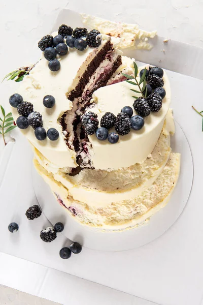 Broken birthday cake on white background. Bad birthday. Spoiled holiday. Bad luck, bad delivery concept.