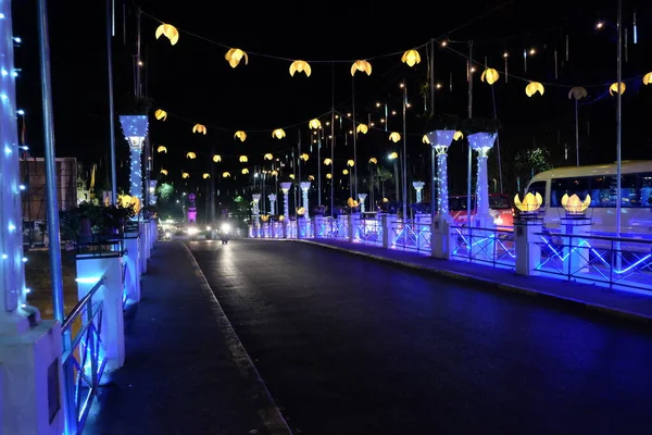 A bridge illuminated by street lamps at night. Beautiful street lighting.