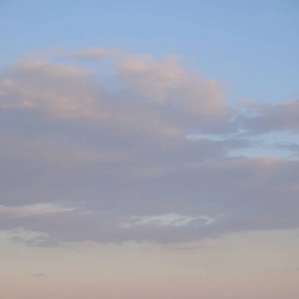 Clouds in the evening sky. Twilight sky as background.