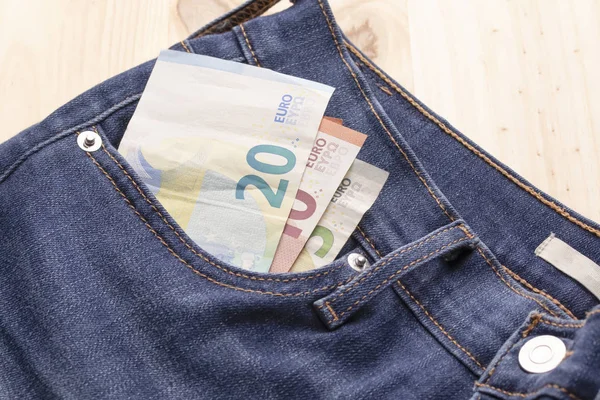 Billetes Euros Bolsillo Jeans Una Mesa Madera — Foto de Stock