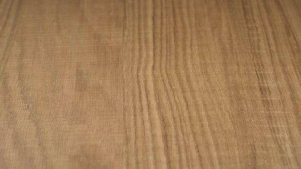 Textured wood finish treated and varnished. Blank for design. Material for the manufacture of furniture. Close up — Stock Footage Textured Wood Finish Treated Varnished Blank Design Material Manufacture Furniture Stock Video