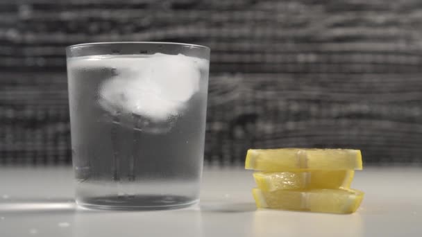 Ice Cubes Move Water Misted Glass Black White Background Table — Stock Video