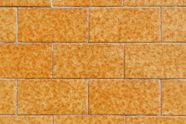 Yellow Brick Wall Made Symmetrical Stone Blocks Orange Brown Spots — Stock Photo, Image