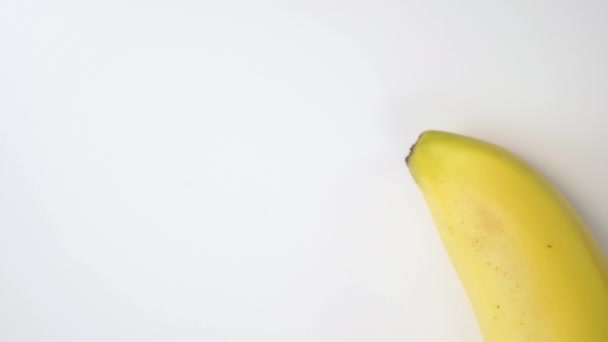 Bright Yellow Ripe Banana Moves White Background Appetizing Fruit Sexy — Stock Video