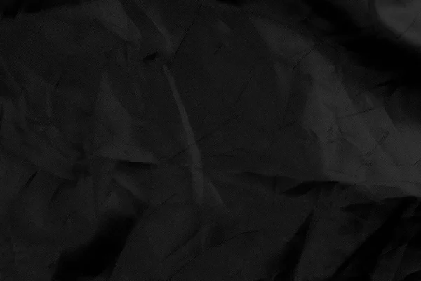 Balící Černý Materiál Vráskami Vrásčitými Záhyby Stará Zmačkaná Syntetická Látka — Stock fotografie