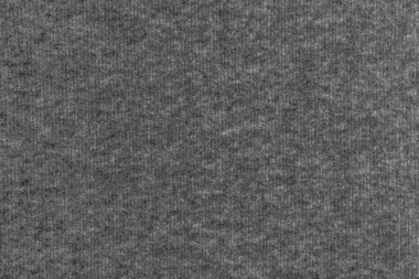 Yünlü, gri, sıcak bir malzeme. Soyut arkaplan. Konfor ve sıcaklık kavramı. Kopyalama alanı