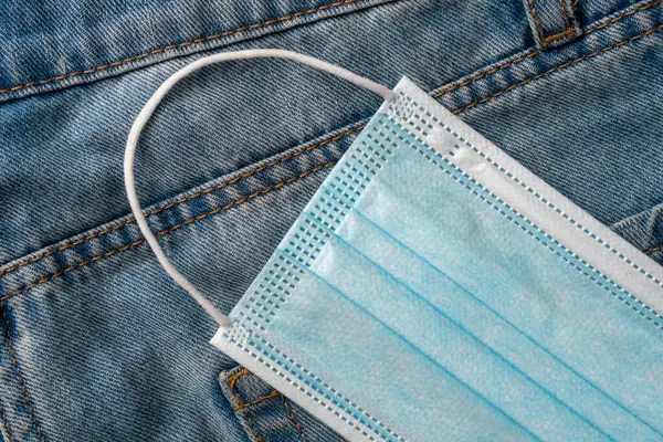 Medical Protective Surgical Mask Pocket Blue Jeans Close Coronavirus Protection — Stock Photo, Image